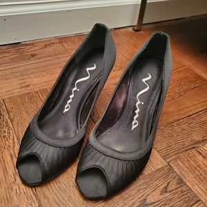 Black satin peep toe pumps